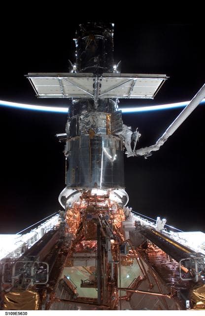 NASA image: EVA 2 - MS Newman and Massimino on HST during sunrise