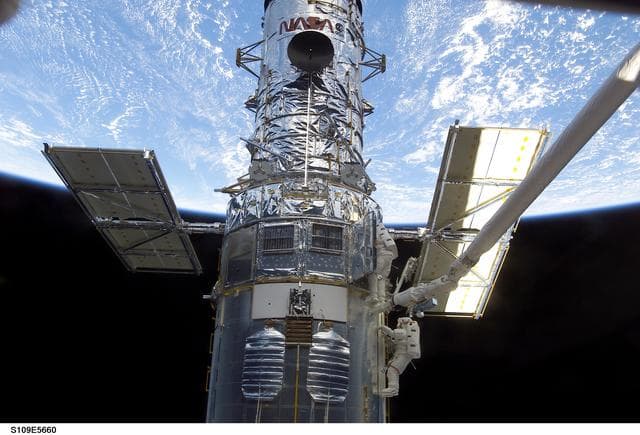 NASA image: EVA 3 - Linnehan and Grunsfeld install new PCU