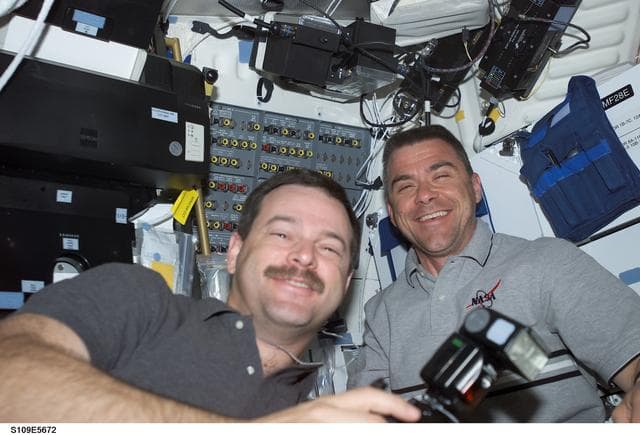 NASA image: CDR Altman and PLT Carey in airlock