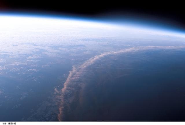 NASA image: View of the terminator over the Earth's limb taken during mission STS-111 UF-2.