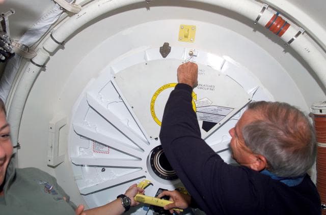 NASA image: Cockrell prepares to open PMA 2 hatch to ingress the ISS U.S. Lab during mission STS-111 UF-2