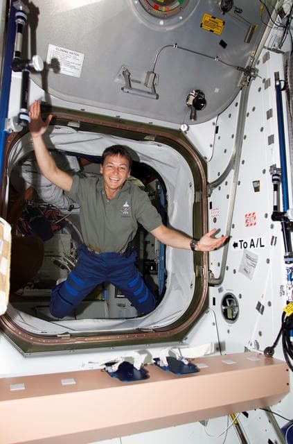 NASA image: Whitson poses for a photo in the access way between U.S. Lab and Node 1, STS-111 UF-2