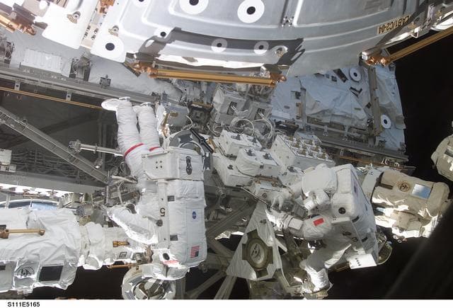 NASA image: Chang-Diaz and Perrin work at the MBS on the S0 (S-zero) truss during STS-111 UF-2 EVA 2