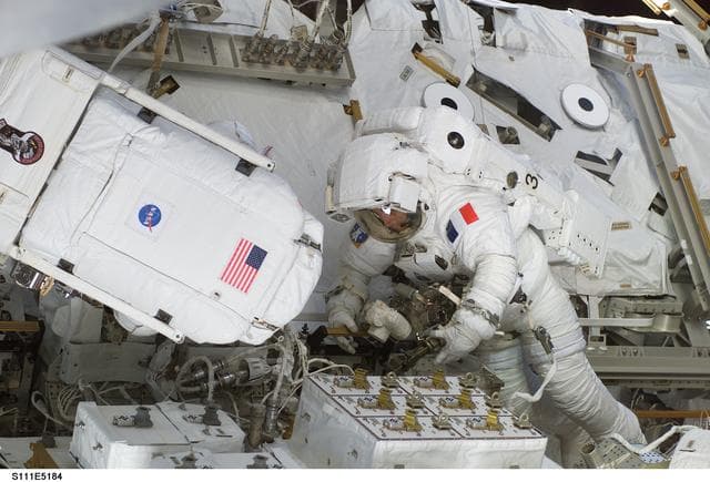 NASA image: Chang-Diaz and Perrin attach power and data cables to MBS during STS-111 UF-2 EVA 2