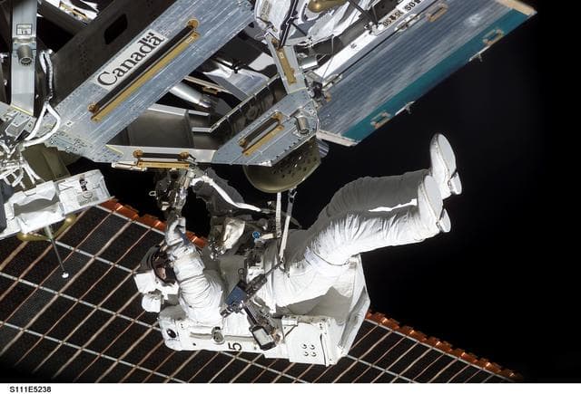 NASA image: Perrin installs the MBS to the Mobile Transporter railcar during STS-111 UF-2 EVA 2