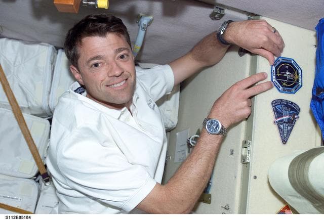 NASA image: STS-112 CDR Ashby with patch in FGB/Zarya module
