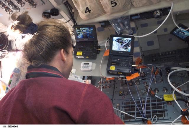 NASA image: PLT Melroy with watches on betcams during EVA 2