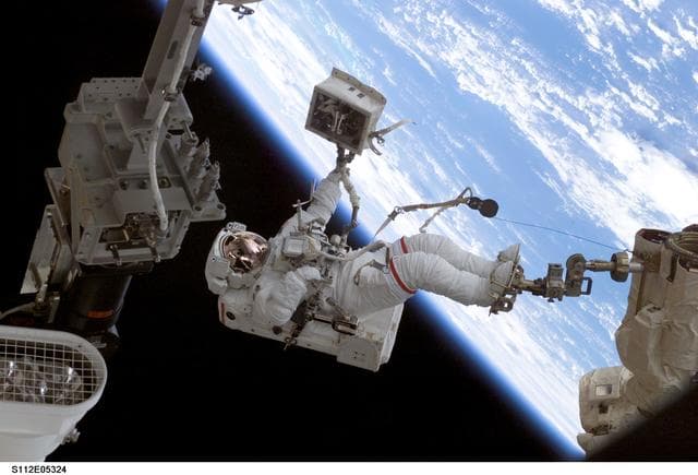 NASA image: MS Wolf with portable toolbox during EVA 2