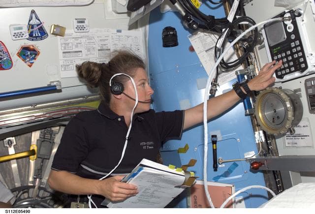 NASA image: PLT Melroy in airlock prior to EVA 3