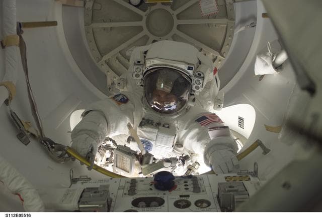 NASA image: MS Wolf leaves airlock during EVA 3