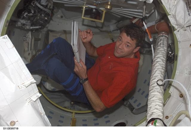 NASA image: CDR Ashby with checklist on ISS