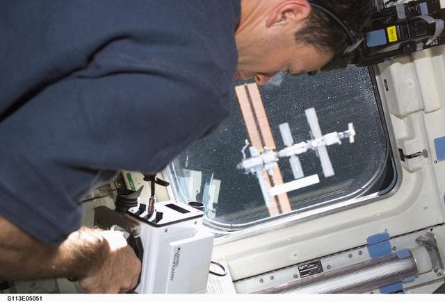 NASA image: MS Michael LA uses a Laser Range Finder on AFD during ISS Rendezvous Operations during STS-113
