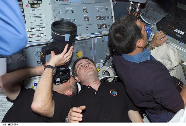 NASA image: Pettit, Budarin, Herrington on AFD during Rendezvous and Docking with the ISS during STS-113