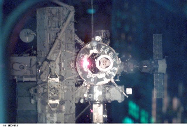 NASA image: ISS views - PMA2, U.S. Lab, SSRMS, AL, S0 Truss, and Soyuz during Docking Operations for STS-113