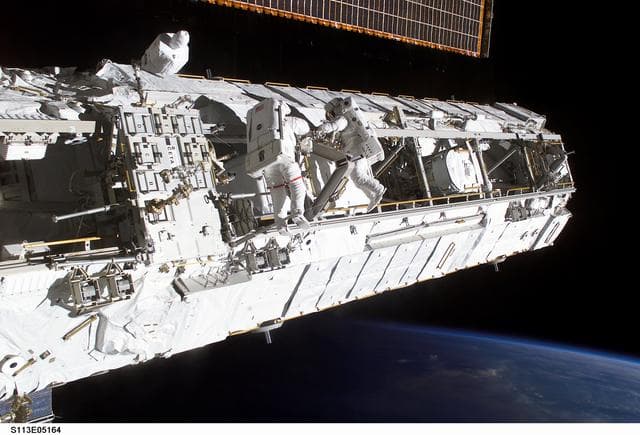 NASA image: MS Lopez-Alegria and MS Herrington Keel Trunnion Pin OPS on P1 Truss during second EVA for STS-113