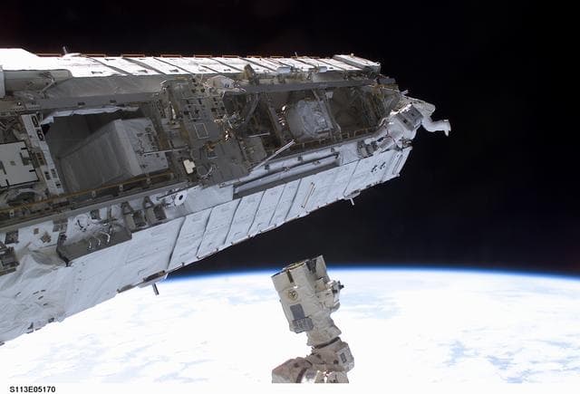 NASA image: MS Lopez-Alegria and MS Herrington Keel Trunnion Pin OPS on P1 Truss during second EVA for STS-113