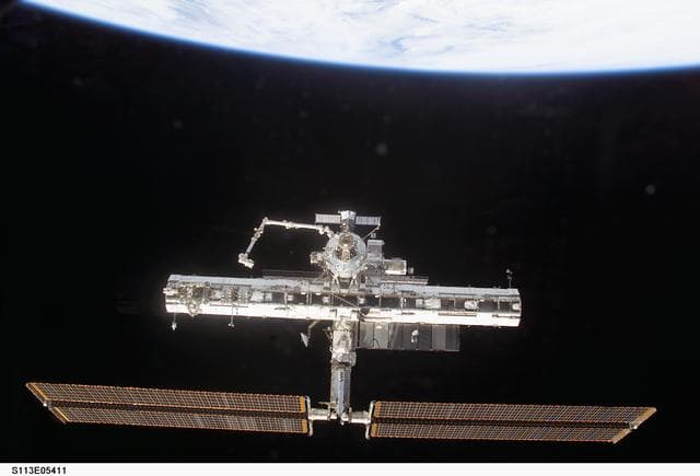 NASA image: Forward view of the ISS taken during flyaround operations following STS-113 undocking