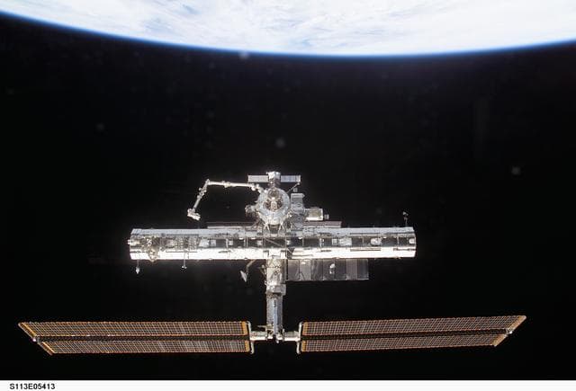 NASA image: Forward view of the ISS taken during flyaround operations following STS-113 undocking