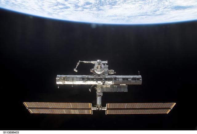 NASA image: Overall exterior views of the ISS during Undocking and Flyaround Operations for STS-113 (11A)