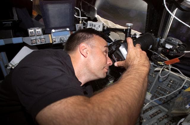 NASA image: Archambault uses camera at the aft FD window during Joint Operations