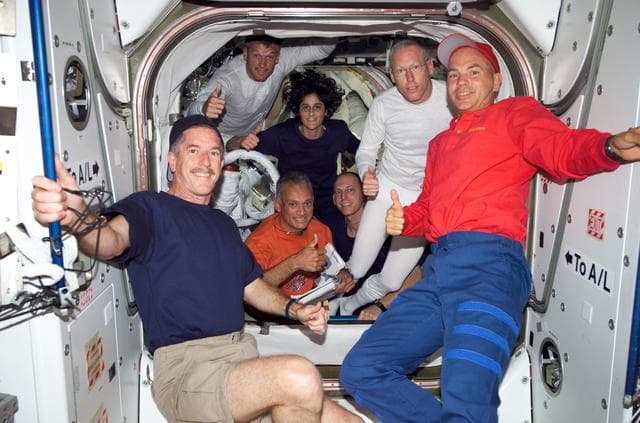 NASA image: STS-117 and Expedition 15 Crew posing for camera in the Quest A/L during Joint Operations