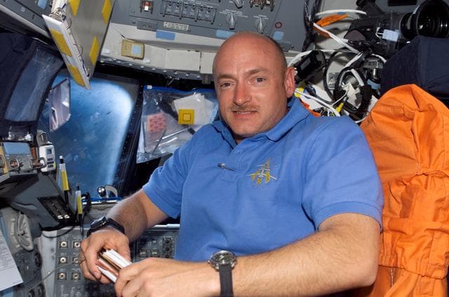 NASA image: Kelly smiles at camera from the PLT seat on the FD during STS-121