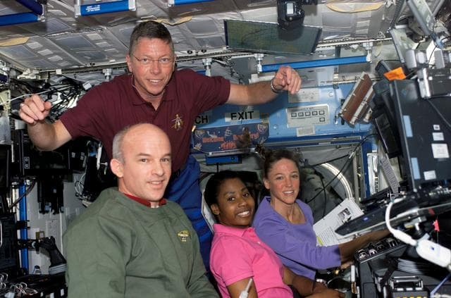 NASA image: Exp. 13 and STS-121 crewmembers work in the U.S. Lab during STS-121/Exp. 13 OPS