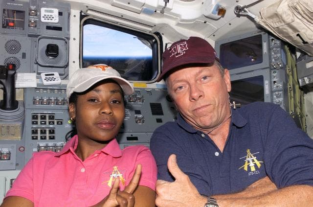 NASA image: Fossum and Wilson pose for a picture together on the AFD during STS-121