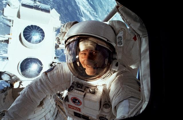 NASA image: STS-37 Mission Specialist Ross in OV-104's payload bay (PLB) during EVA