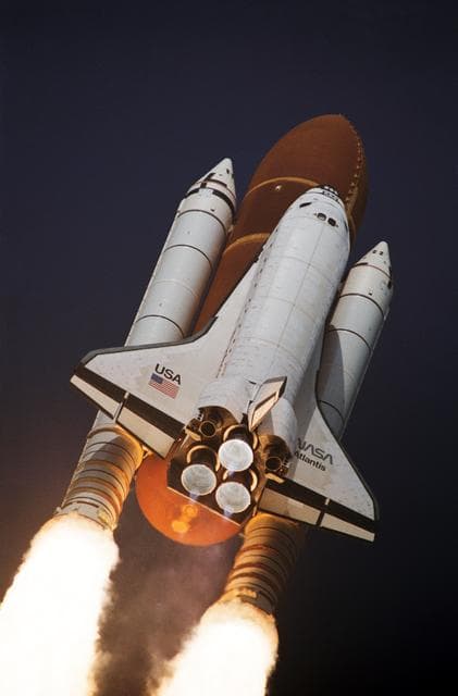 NASA image: STS-45 Atlantis, OV-104, begins its roll maneuver after liftoff from KSC