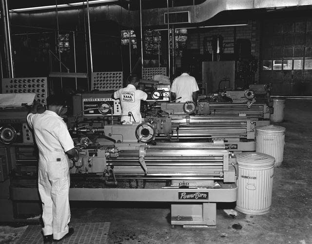 NASA image: CRAFTSMAN WORKING IN CANADA DRY BLDG.