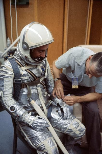 NASA image: ASTRONAUT VIRGIL I. GRISSOM - SUIT - SUIT ADJUSTMENT - CAPE