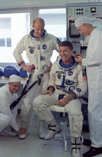 NASA image: GEMINI-TITAN (GT)-7 - PRIME CREW SUITING-UP (W/O HELMETS) - (1ST TRY) - CAPE