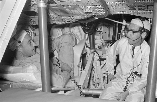 NASA image: GRISSOM, VIRGIL I., ASTRONAUT - TRAINING - CREW CHECKS SPACECRAFT (S/C) EQUIPMENT - NORTH AMERICAN AVIATION, INC. (NAA), DOWNEY, CA