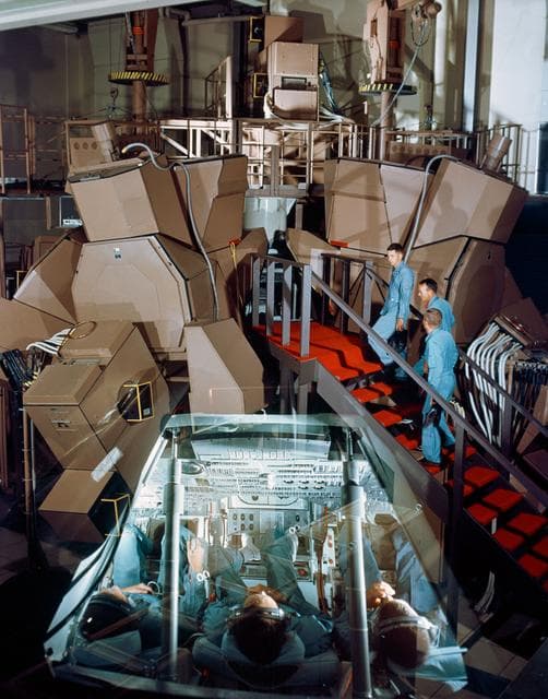 NASA image: Dual exposure view of exterior and interior of  Apollo Mission simulator