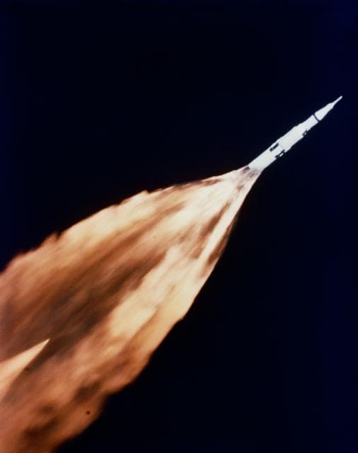NASA image: F-1 engines of Apollo/Saturn V first stage leave trail of flame after liftoff