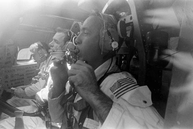 Apollo 9 prime crew inside Apollo command module boilerplate during training