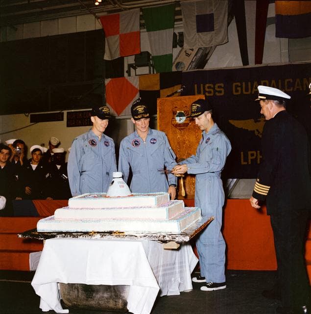 NASA image: Apollo 9 crew prepares to cut cake on U.S.S. Guadalcanal