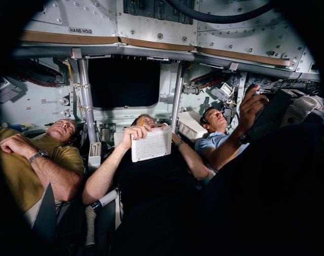 View of Apollo 14 crewmen in Command Module simulation training