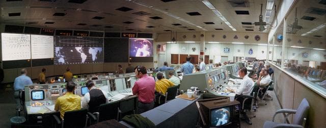 Wide angle view of Mission Control Center during Apollo 14 transmission