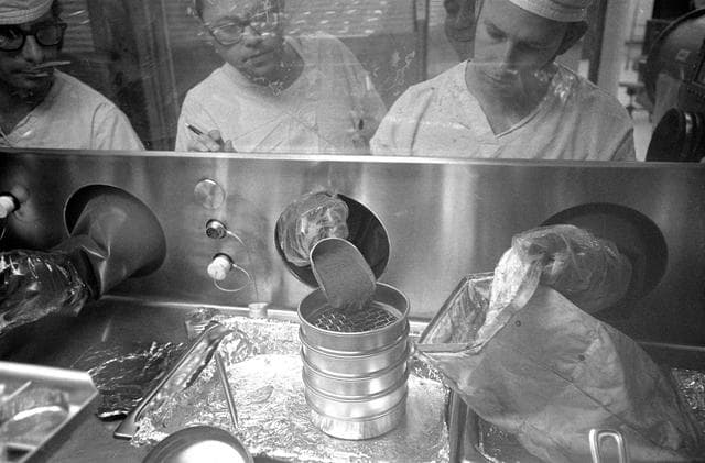 NASA image: Technicians work with Apollo 14 lunar sample material in Lunar Receiving Lab.