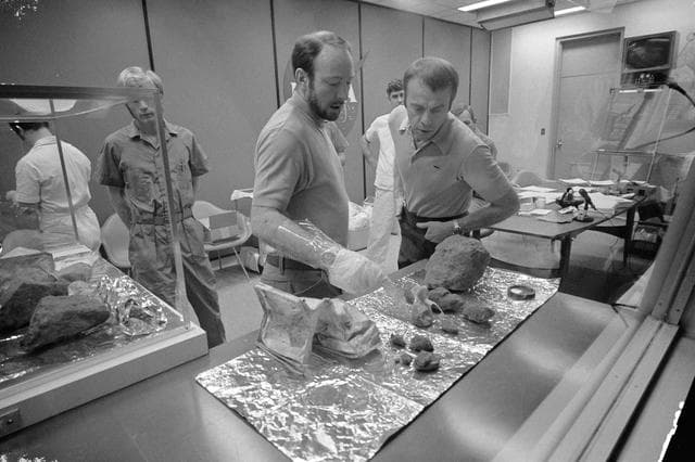 NASA image: Apollo 14 crewmen show off lunar rocks during meeting with newsmen