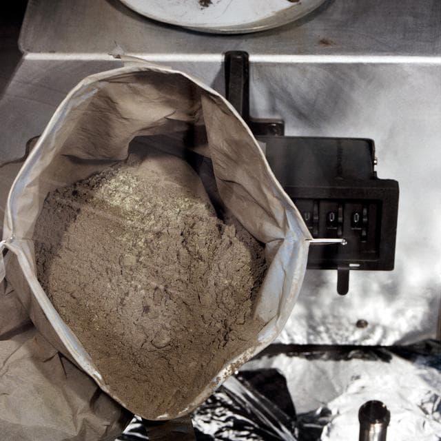 NASA image: View of container of green-colored lunar soil in Lunar Receiving Laboratory