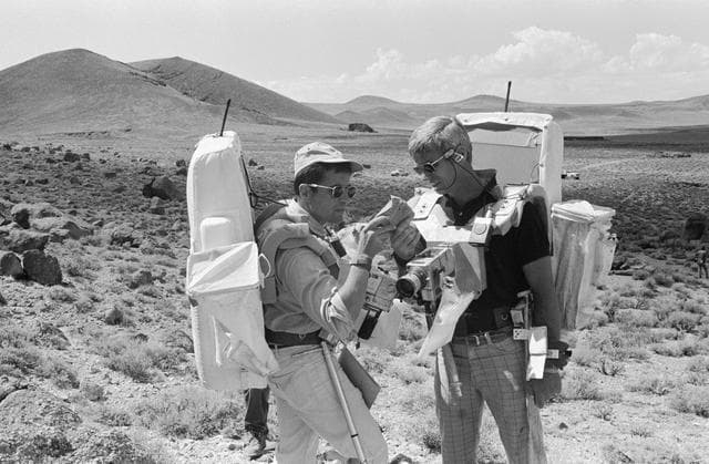 NASA image: Apollo 17 Crewmembers - Rock Specimen Exam - Geological Field trip - NV