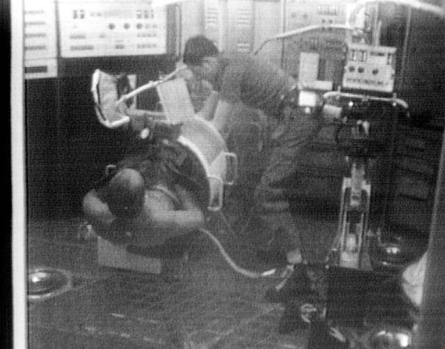 NASA image: Astronaut Charles Conrad as test subject for Lower Body Negative Pressure
