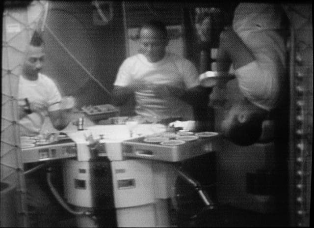 NASA image: Skylab 3 crewmen shown eating in Orbital Workshop wardroom