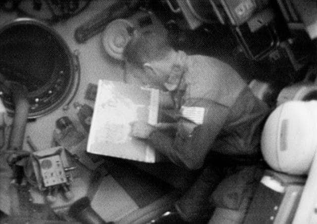NASA image: Skylab 3 Television Transmission - Lousma studies map of U.S.
