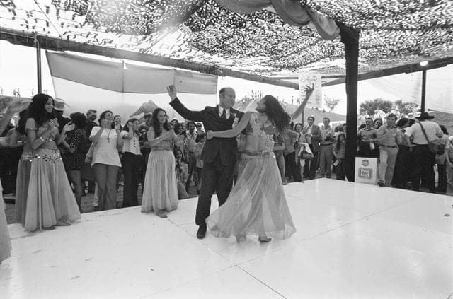 Cosmonaut Aleksey Leonov joins belly dancer on stage at Folklife Festival