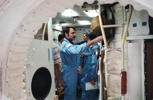 NASA image: STS 51-E crew is briefed on the Shuttle full fuselage trainer