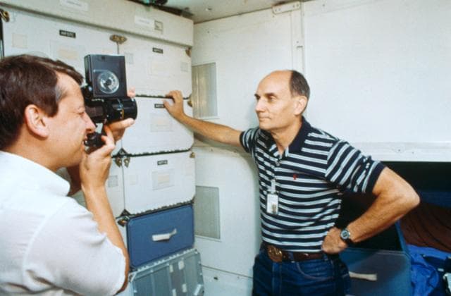 NASA image: Sen. Jake Garn and payload specialist Charles Waler in middeck simulation